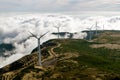 Wind Turbines, Windmill Generators farm over the clouds. Royalty Free Stock Photo