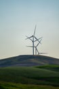 Wind turbines or windmills in the rolling farm fields of the Palouse in Washington State Royalty Free Stock Photo
