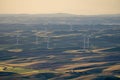 Wind turbines or windmills in the rolling farm fields of the Palouse in Washington State Royalty Free Stock Photo