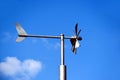 Wind vane. Anemometer wind speed indicator and measuring device. steel tube post Royalty Free Stock Photo