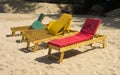 Windblown loungers on a white sand beach Royalty Free Stock Photo