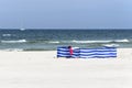 Windbreak on a wide golden beach at the Polish seaside