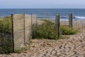 Windbreaker fences are seen at the beach. Royalty Free Stock Photo