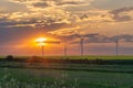 windfarm green field at sunset Royalty Free Stock Photo