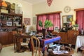 A cute and cozy antique shop with furniture and decor items