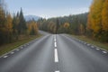 Winding asphalt road in beautiful autumn landscape