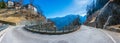 Winding asphalt road with Italian Alps panorama, Trento, Italy