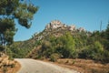 winding Asphalt road with a view of a lonely mountain with a rock in the countryside area in Turkey Royalty Free Stock Photo