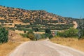 winding Asphalt road with a view of a lonely rocky mountain in the countryside area in Turkey Royalty Free Stock Photo