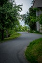 Winding asphalted road leading to the church on the hill. Royalty Free Stock Photo