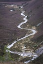 Winding Burn by the Cairngorm Mountain in Scotland. Royalty Free Stock Photo