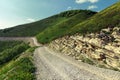 Winding country hiking road in the mountains leading up Royalty Free Stock Photo