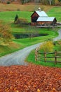 A winding country lane leads to a bucolic farm Royalty Free Stock Photo