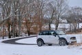 Winding Country Road and Car in Winter Royalty Free Stock Photo