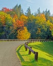 winding, curving road with wooden side railings early Fall Catskill Mountains