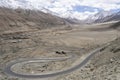 Winding curvy rural road with light trail from headlights leading through Ladakh in India