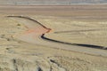 Winding desert road in the Australian Outback near Coober Pedy, Australia. Royalty Free Stock Photo