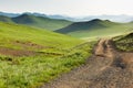 Winding dirt road through Central Mongolian steppe