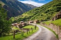 a winding footpath leading to a small mountain village