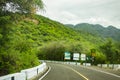 Winding metalled road passing through green hills of india Royalty Free Stock Photo