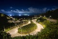 Winding mountain road lit at night Royalty Free Stock Photo