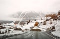 Winding mountain road near the alpine village Zernez in winter. Canton of Graubuenden, Switzerland Royalty Free Stock Photo