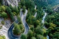 Winding mountain road next to a river Royalty Free Stock Photo
