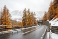 Winding mountain road during snowfall near the village Zernez. Canton of Graubuenden, Switzerland Royalty Free Stock Photo