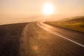 Winding mountain road at sunset