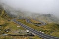 Winding mountain road Transfagarasan and fog in Romania Royalty Free Stock Photo