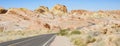 Winding narrow road across the hot desert