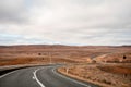 Winding open empty road surrounded by farms and fields in Outback Australia. Road trip travel Royalty Free Stock Photo