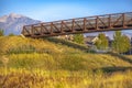 Winding path and bridge against mountain and sky Royalty Free Stock Photo