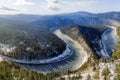 A winding river covered in snow. the water gradually freezes. First autumn frosts, nature of Russia, Siberia. Beautiful