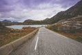 Winding road along mountains and fjord Royalty Free Stock Photo