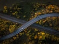 Winding road in autumn forest at sunset in mountains. Royalty Free Stock Photo