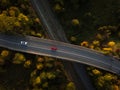 Winding road in autumn forest at sunset in mountains. Royalty Free Stock Photo