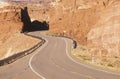 A winding road curves through red rock in the desert southwest USA Royalty Free Stock Photo