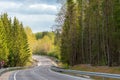Winding road down the hill in spring Royalty Free Stock Photo