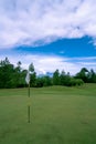 Putting Green on the Golf course and Beautiful clouds in the sky