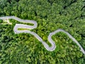 Winding road in the forest. Aerial view shot with a drone. Royalty Free Stock Photo