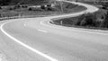 Winding road going into the distance. Black and white image. Travel concept