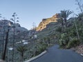 Winding road at Guarimiar village. At hiking trail through Barranco de Guarimiar Gorge. Green mountain canyon slopes