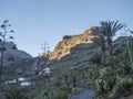 Winding road at Guarimiar village. At hiking trail through Barranco de Guarimiar Gorge. Green mountain canyon slopes