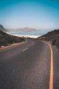 Winding road leading down to the seaside and beach