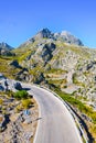 Winding road leading through mountains Royalty Free Stock Photo