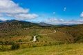 Winding road leading uphills. Mountain landscape. Trekking concept Royalty Free Stock Photo