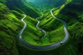 Serpentine Road Through Lush Green Hills Royalty Free Stock Photo