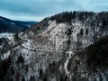 Landscape with winding road through mountain, aerial view