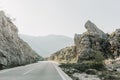 Winding road mountainous terrain road sign no overtaking